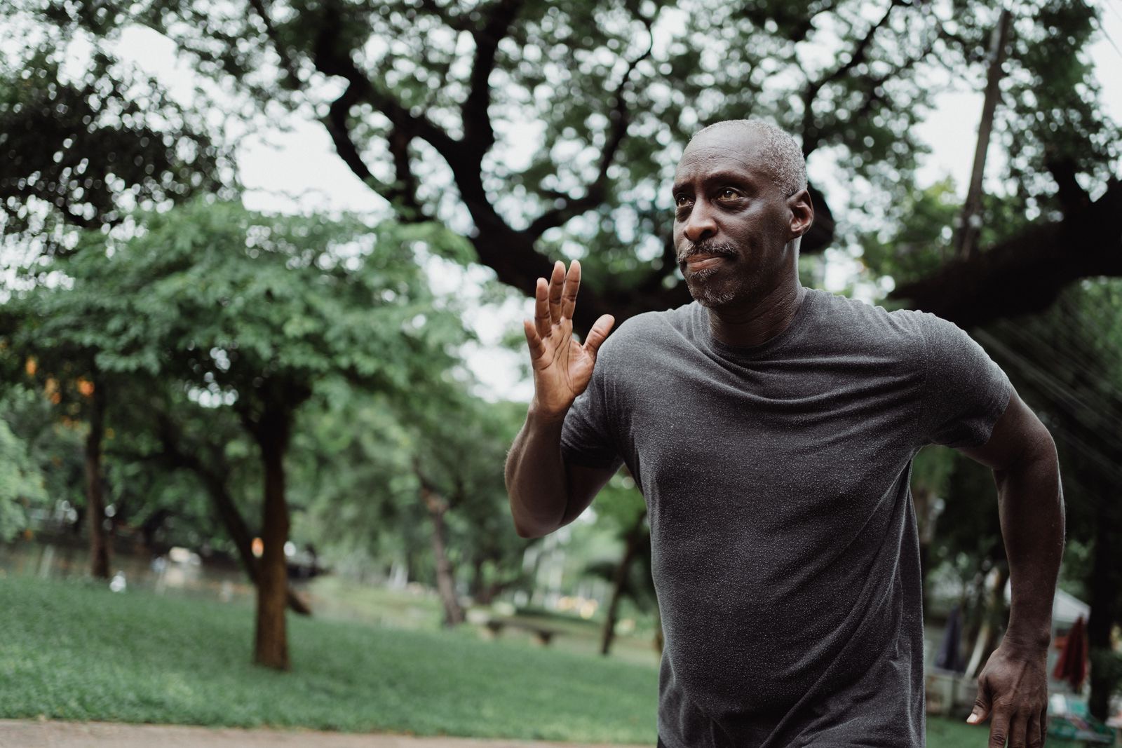 A healthy, active older man running outdoors